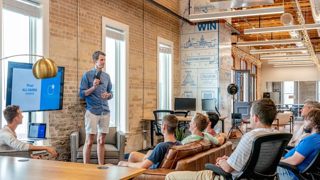 A team meeting in a bright open-plan office